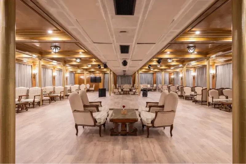Kleos Nile Cruise indoor restaurant with dining setup